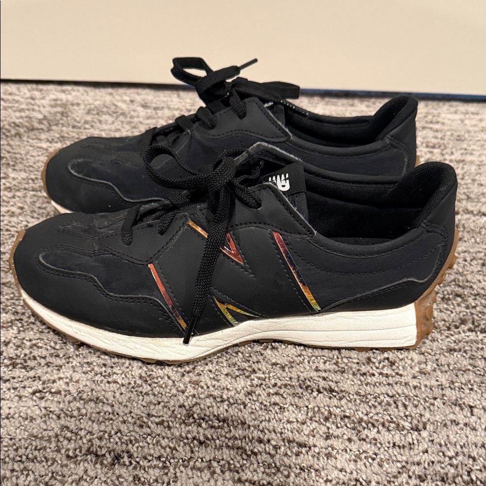 New Balance Black Sneakers with Red and Yellow Accent Stripes and Gum Sole